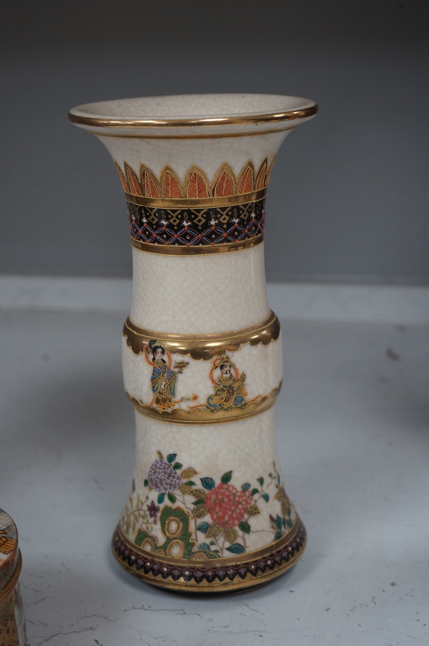 A Japanese Satsuma circular box and cover, a similar vase and an Imari sleeve vase, largest 30cm high. Condition - sleeve vase cracked, others good